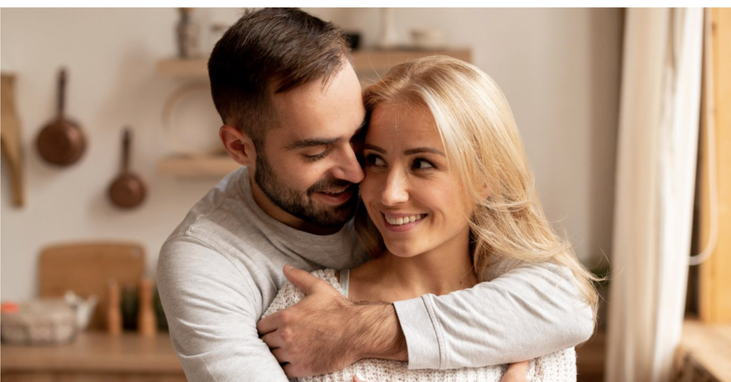 A couple embracing at home, from the original Camelot Introductions website
